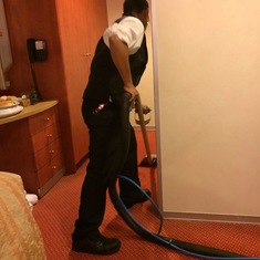 The housekeeper shampooing outside the bathroom