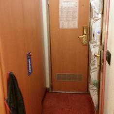 Hallway, bathroom on the right and closets on the left