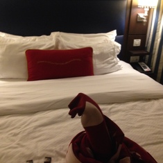 nicely made bed w/ a little surprise. I want more chocolates please for 5 peeps!