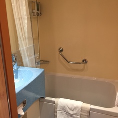 Second bathroom with sink and tub