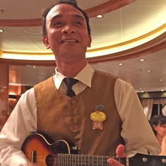Singing Waiter accompanied by his Ukulele